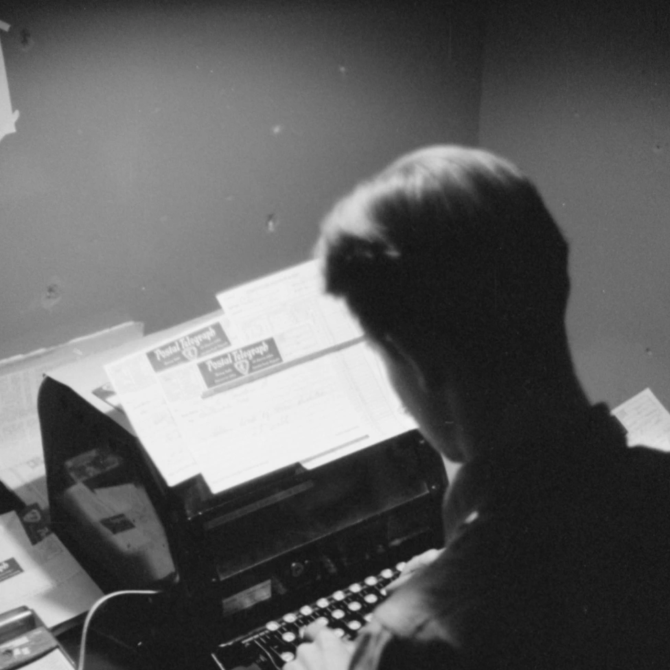 Why Earnest Training Center Picture of a person typing on a typewriter.